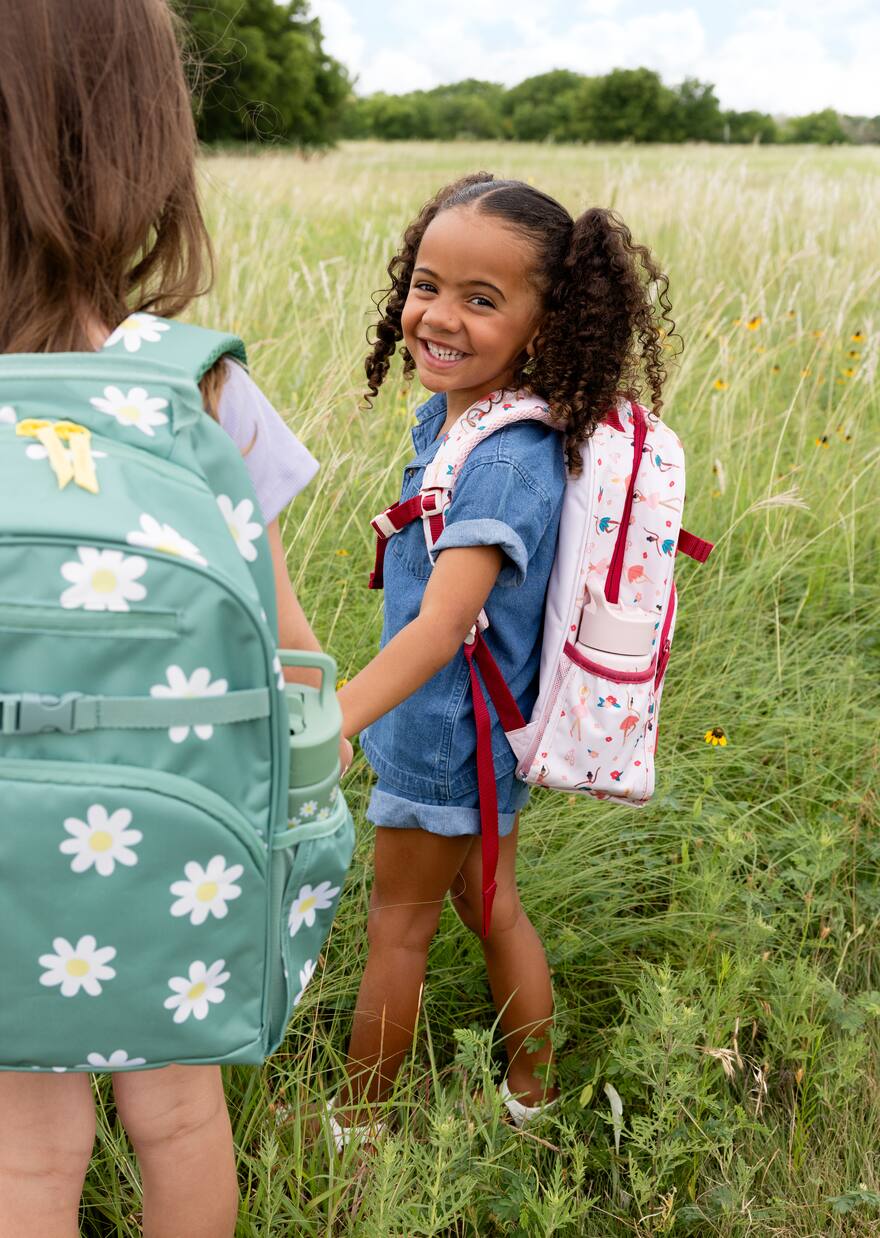 Children wearing colorful backpacks